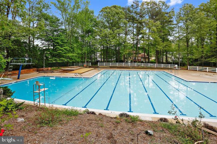 2110 Sandy Court Crofton, MD 21114 - Photo 42 of 50 a view of a swimming pool with an outdoor space and seating area
