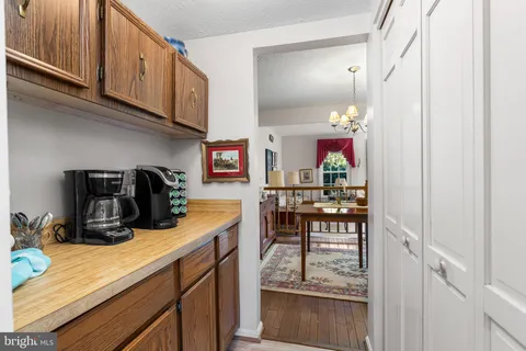 a kitchen with sink and cabinets