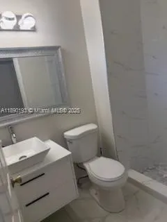 a living room with furniture and a mirror