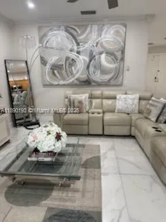 a dining room with furniture a window and a kitchen view