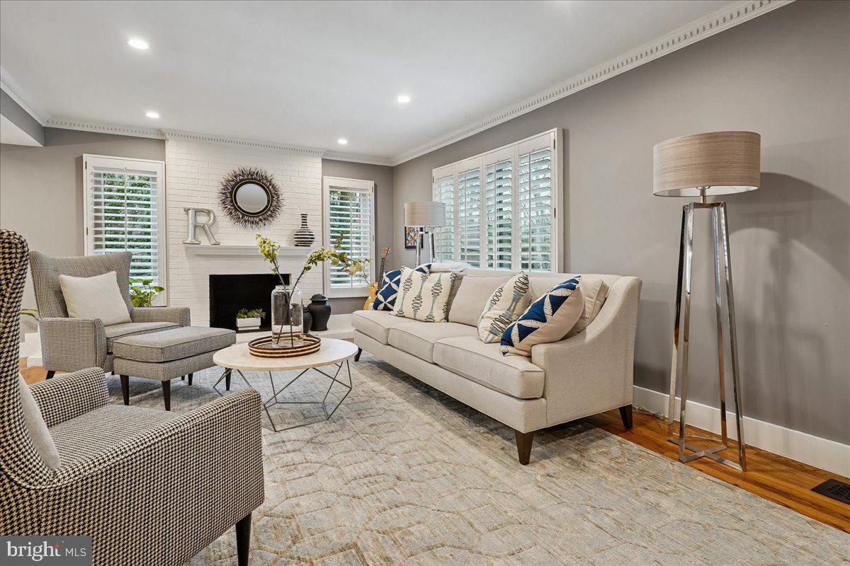 2111 Lirio Court Reston, VA 20191 - Photo 11 of 40 a living room with furniture a large window and a fireplace