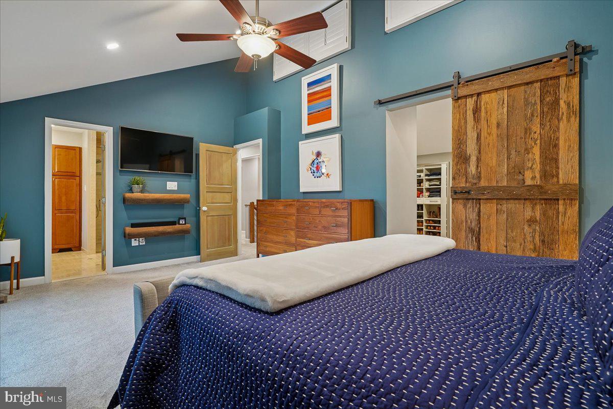 2111 Lirio Court Reston, VA 20191 - Photo 17 of 40 a bedroom with a bed and a large mirror