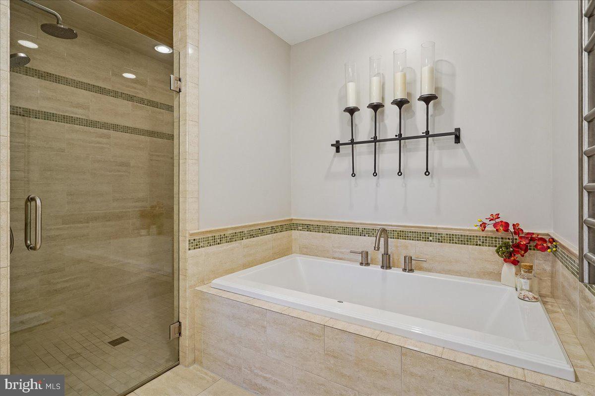 2111 Lirio Court Reston, VA 20191 - Photo 19 of 40 a bathroom with a bathtub and shower
