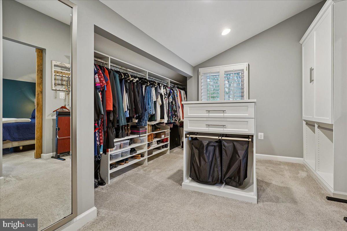 2111 Lirio Court Reston, VA 20191 - Photo 20 of 40 a view of walk in closet with clothes and shoes