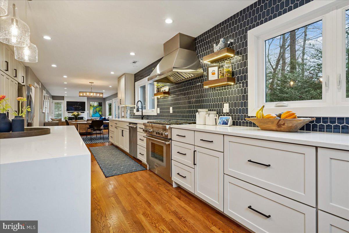 2111 Lirio Court Reston, VA 20191 - Photo 2 of 40 a large white kitchen with stainless steel appliances granite countertop lots of counter top space