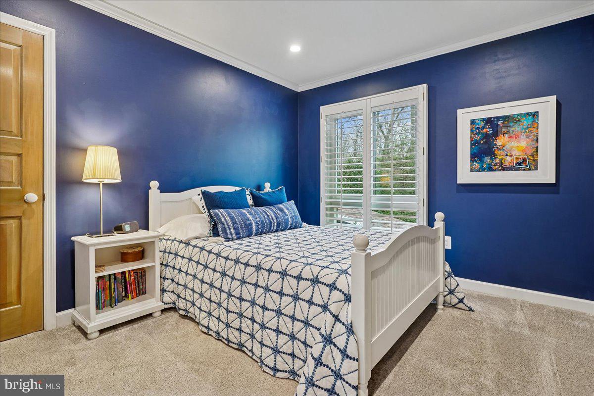 2111 Lirio Court Reston, VA 20191 - Photo 22 of 40 a bedroom with a bed and a night stand