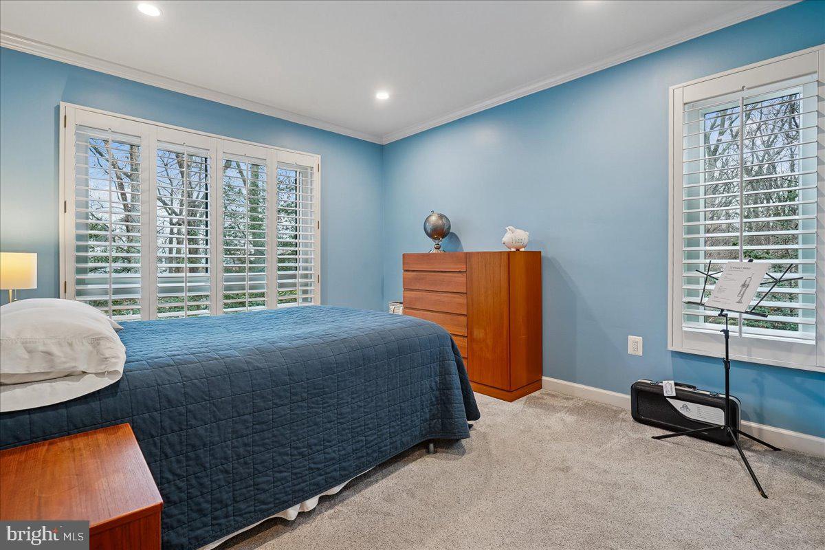 2111 Lirio Court Reston, VA 20191 - Photo 23 of 40 a bedroom with a bed and a window