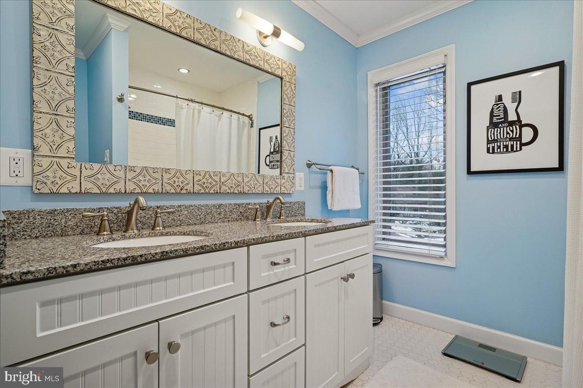 2111 Lirio Court Reston, VA 20191 - Photo 24 of 40 a bathroom with a sink and a mirror