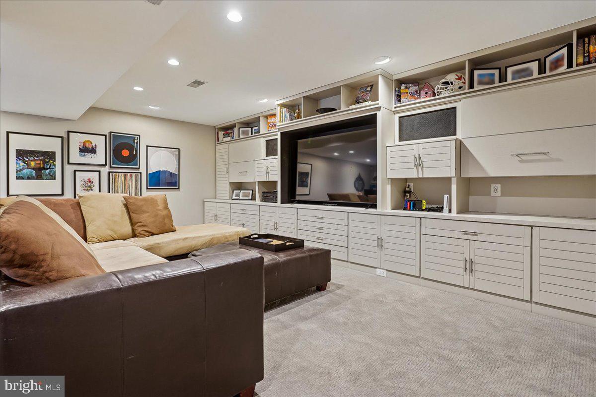 2111 Lirio Court Reston, VA 20191 - Photo 26 of 40 a living room with furniture and a flat screen tv