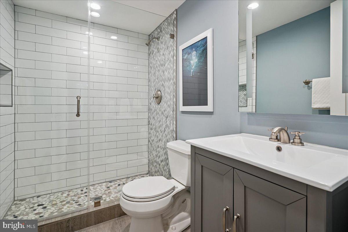 2111 Lirio Court Reston, VA 20191 - Photo 29 of 40 a bathroom with a sink toilet and shower