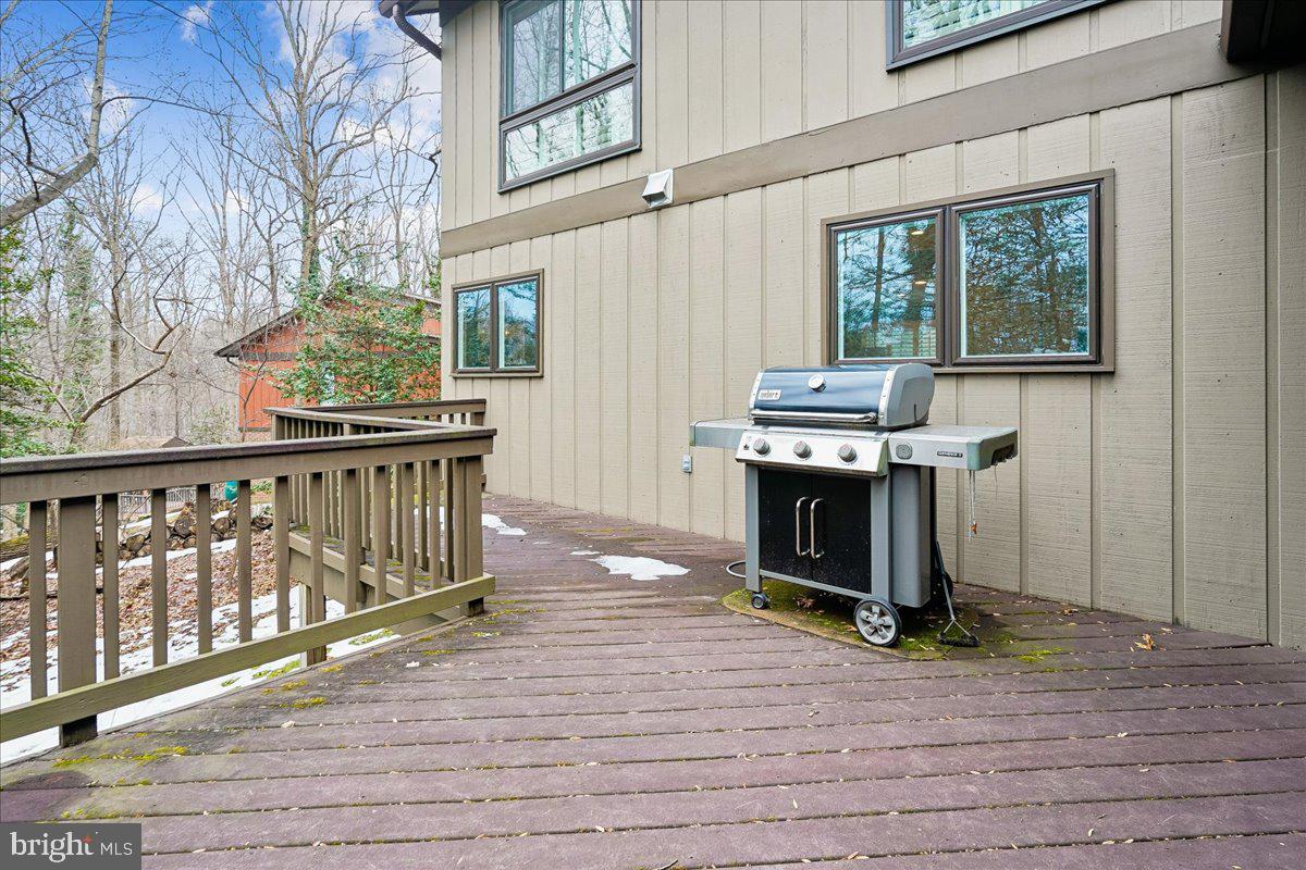 2111 Lirio Court Reston, VA 20191 - Photo 34 of 40 a living room with a fireplace in front of a house