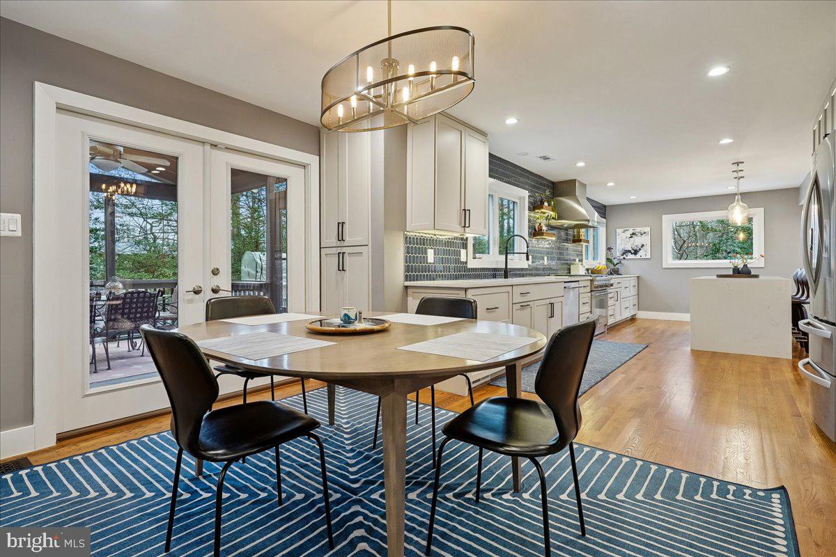 2111 Lirio Court Reston, VA 20191 - Photo 5 of 40 a view of a dining room with furniture window and wooden floor