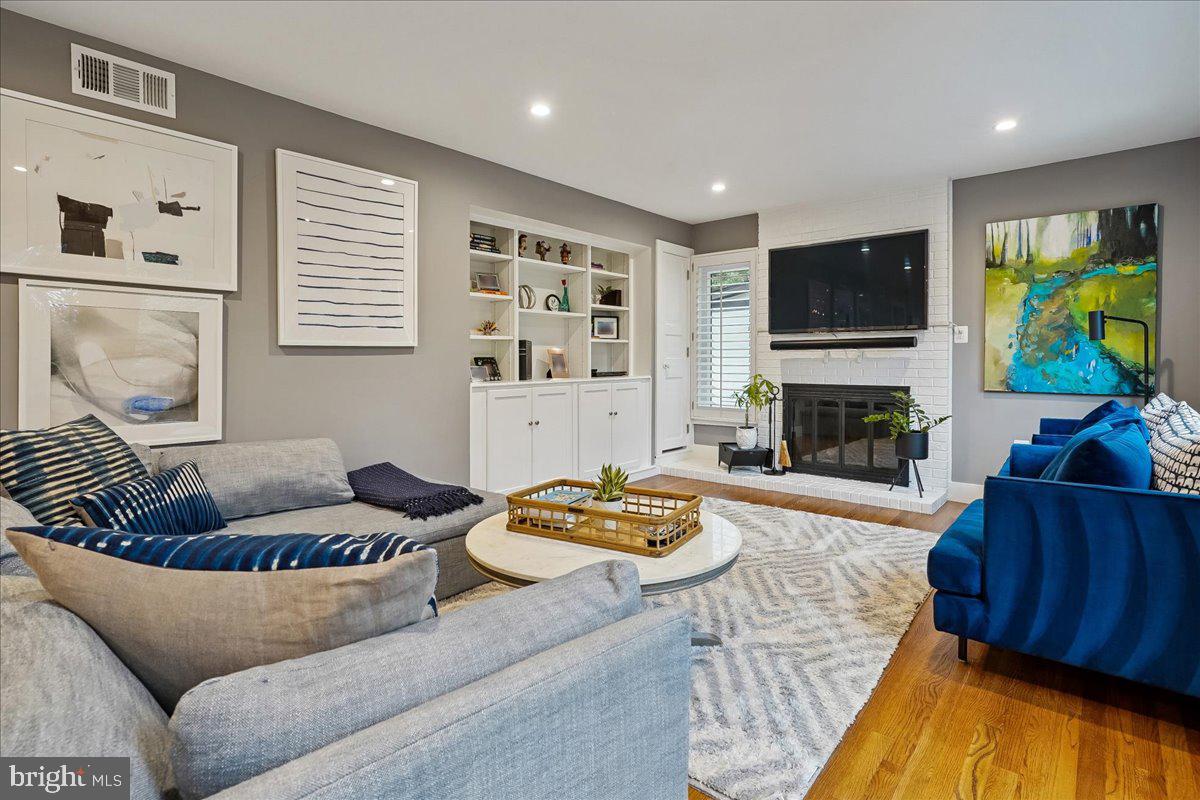 2111 Lirio Court Reston, VA 20191 - Photo 7 of 40 a living room with furniture and a fireplace