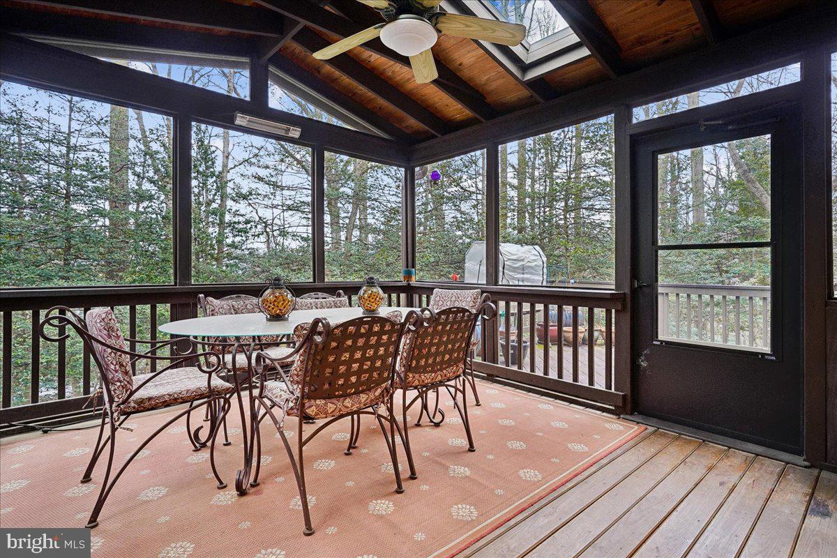 2111 Lirio Court Reston, VA 20191 - Photo 9 of 40 a view of a dining room with furniture window and wooden floor