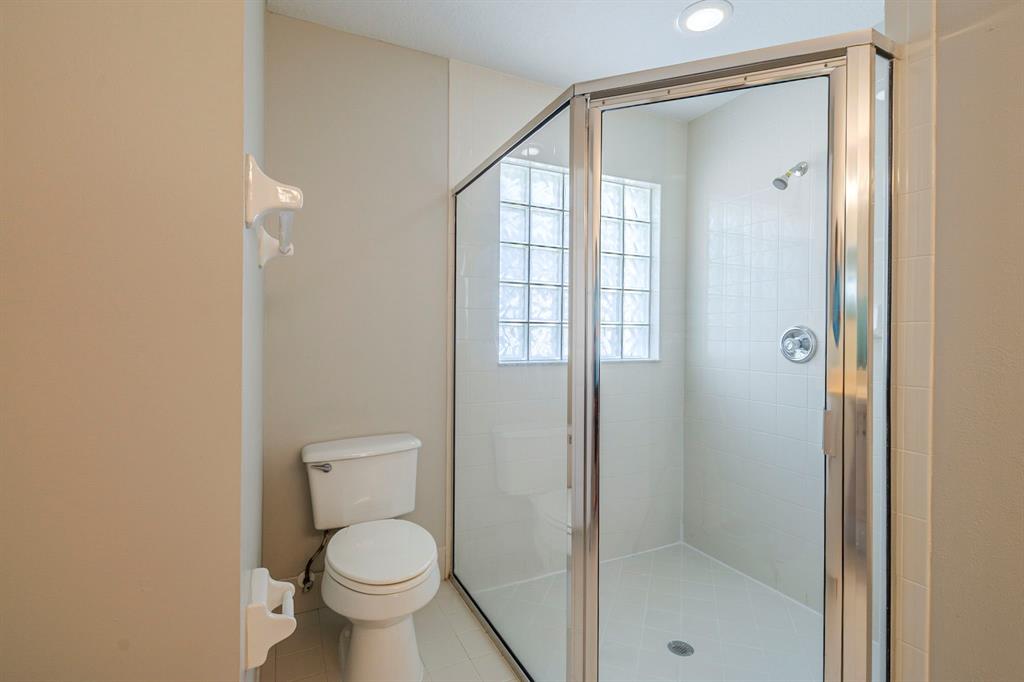 1875 Barnstable Road Wellington, FL 33414 - Photo 17 of 29 a bathroom with a toilet and a shower