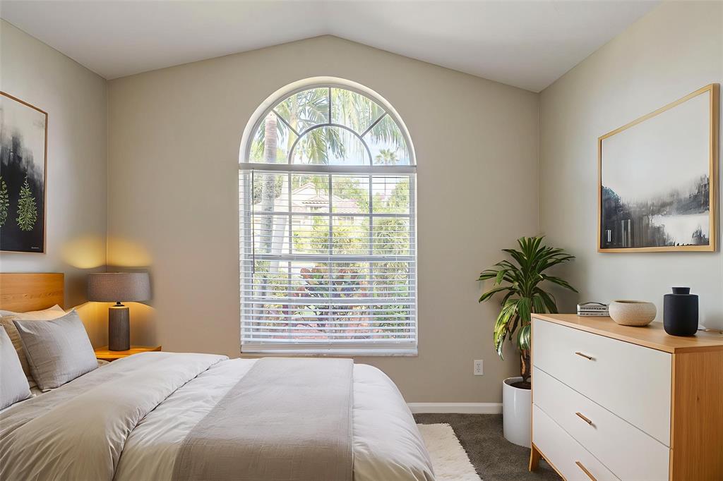 1875 Barnstable Road Wellington, FL 33414 - Photo 20 of 29 a bedroom with a bed and a window