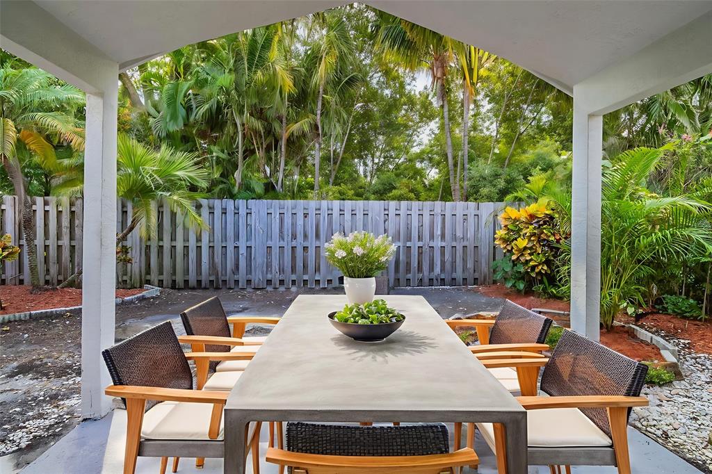 1875 Barnstable Road Wellington, FL 33414 - Photo 25 of 29 a view of a patio with a table chairs and a table
