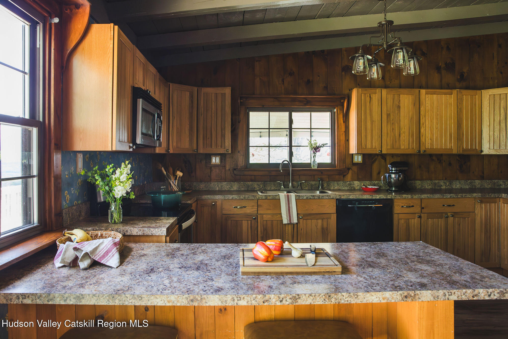 506 Cunningham Road Durham, NY 12422 - Photo 15 of 37 a kitchen with a granite countertop sink and a granite counter tops