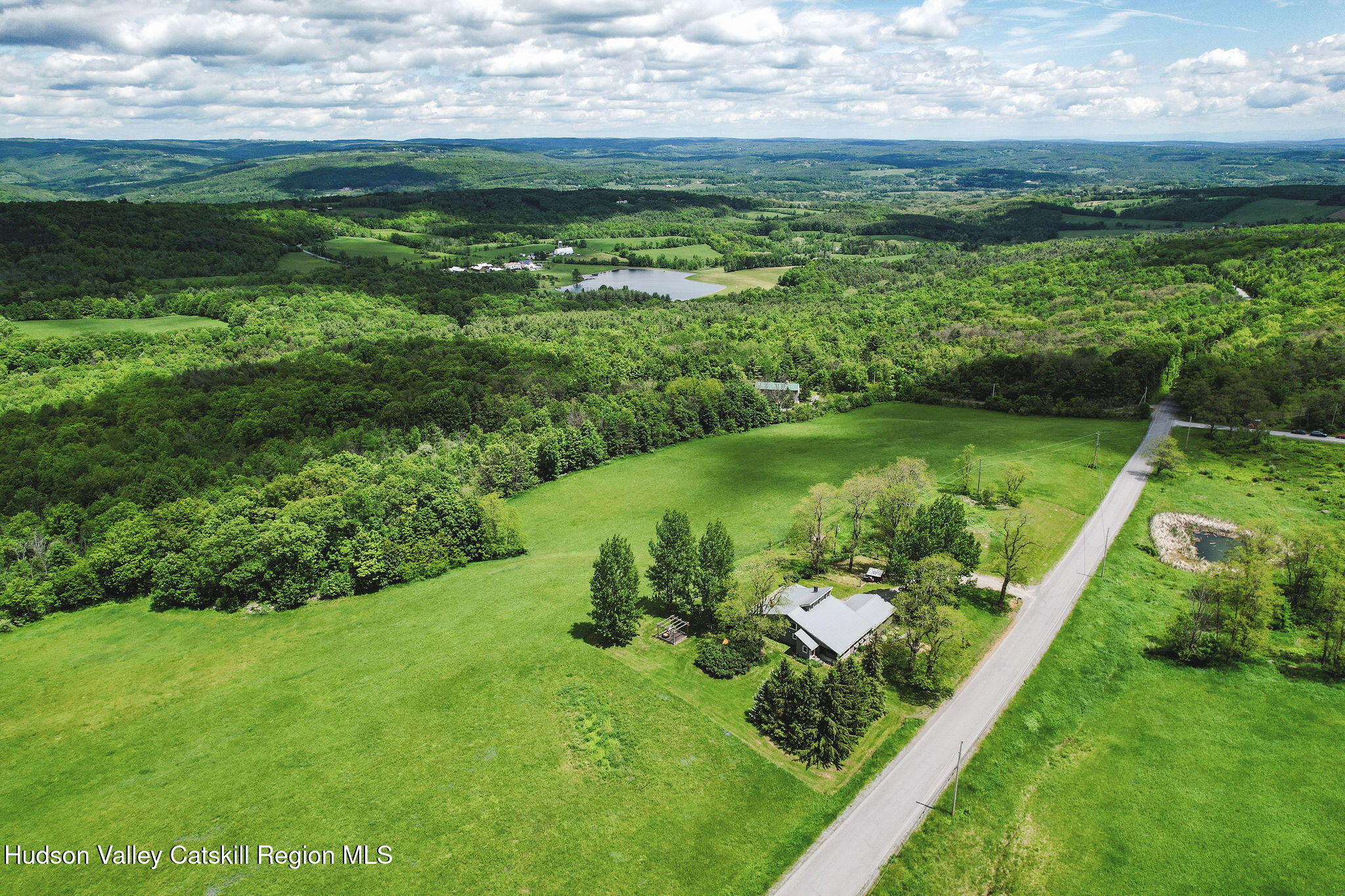 506 Cunningham Road Durham, NY 12422 - Photo 36 of 37 a view of a lake with a yard