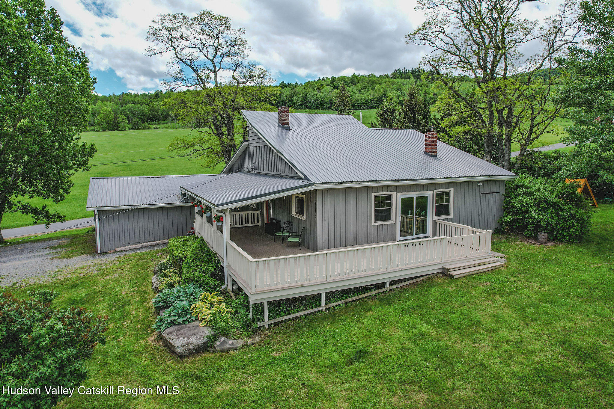 506 Cunningham Road Durham, NY 12422 - Photo 9 of 37 a aerial view of a house with a yard table and chairs