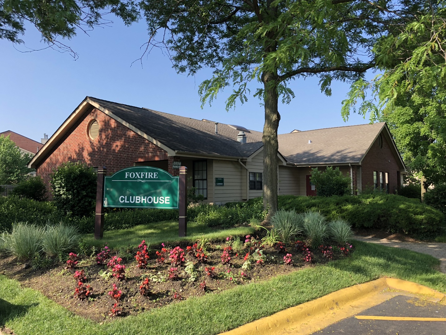 2048 North Rand Road, Unit 202 Palatine, IL 60074 - Photo 1 of 12 a front view of a house with a yard