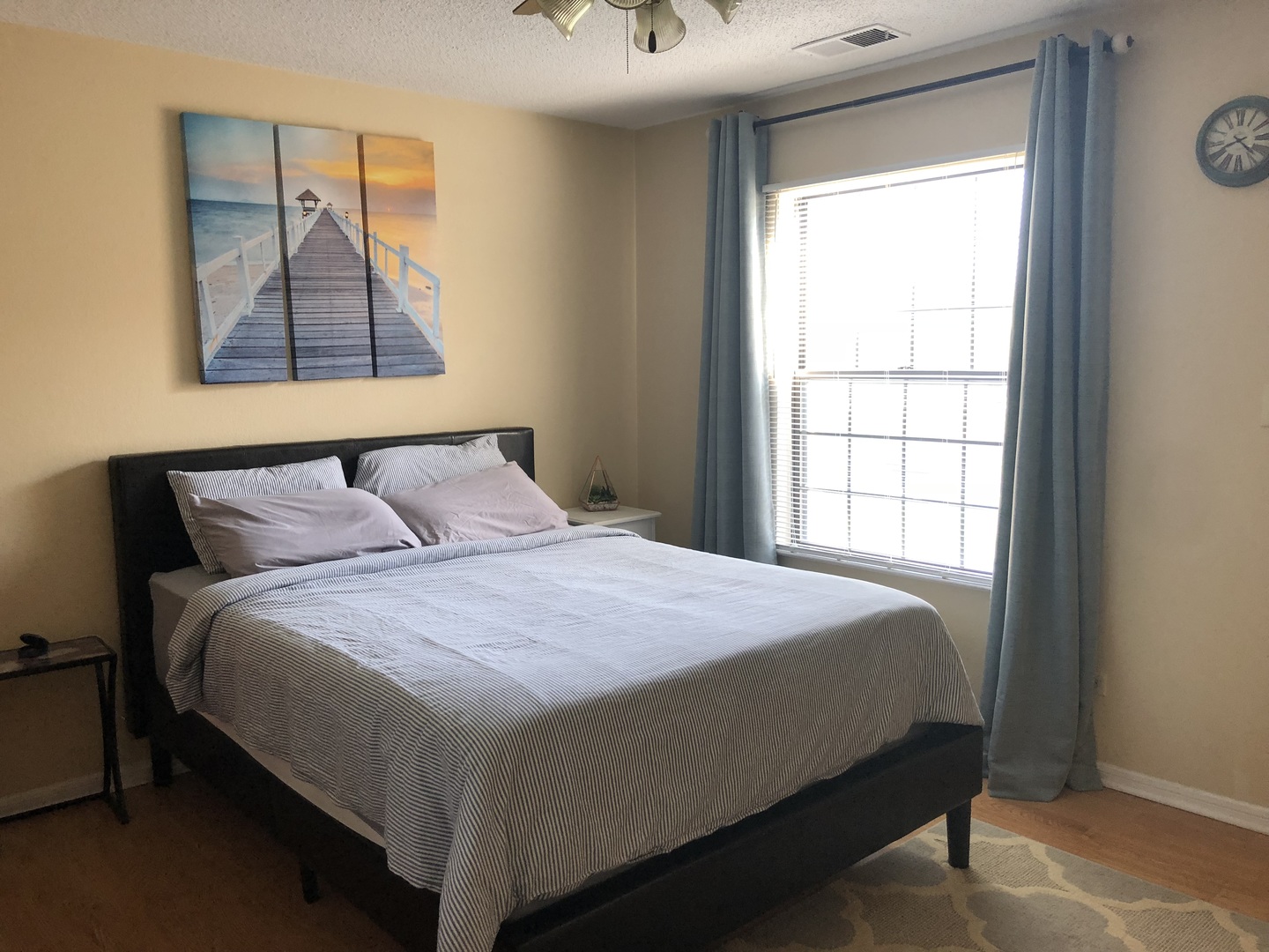 2048 North Rand Road, Unit 202 Palatine, IL 60074 - Photo 6 of 12 a bedroom with a bed and a window