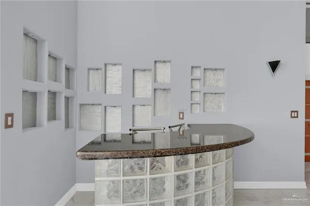 a kitchen with stainless steel appliances granite countertop a sink and cabinets