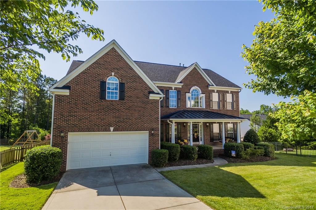 634 Panthers Way Fort Mill, SC 29708 - Photo 1 of 24 a front view of a house with a yard