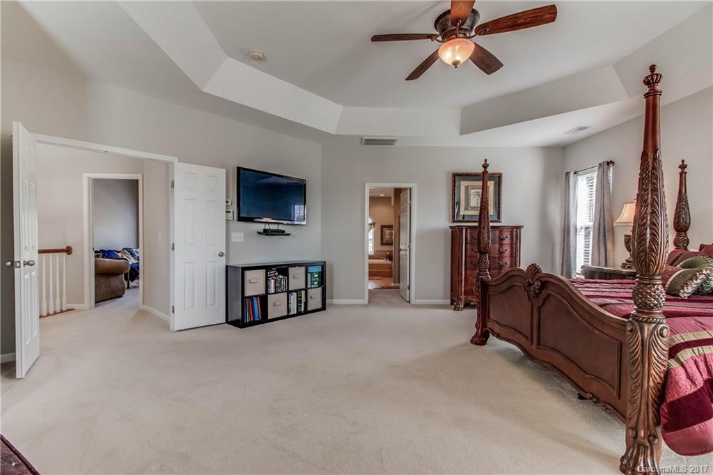 634 Panthers Way Fort Mill, SC 29708 - Photo 15 of 24 a living room with furniture and a flat screen tv