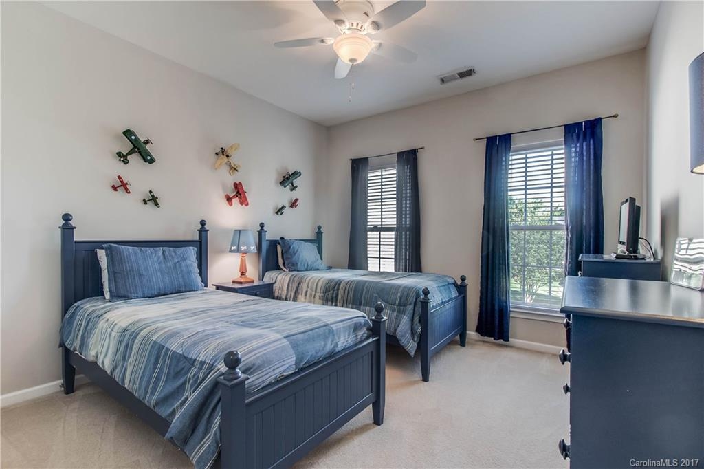 634 Panthers Way Fort Mill, SC 29708 - Photo 18 of 24 a bedroom with a large bed and a window