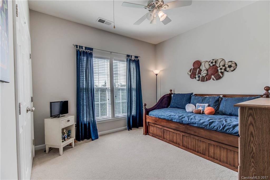 634 Panthers Way Fort Mill, SC 29708 - Photo 20 of 24 a living room with furniture and a flat screen tv