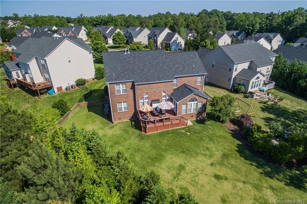 634 Panthers Way Fort Mill, SC 29708 - Photo 24 of 24 an aerial view of a house with a garden and trees