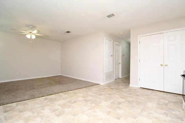 an empty room with a bathroom