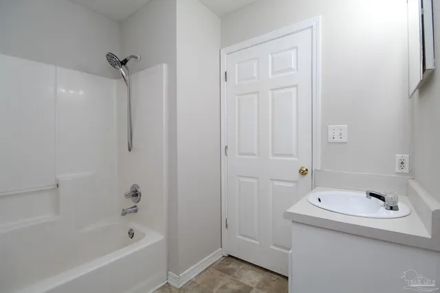 a bathroom with a sink and a bathtub