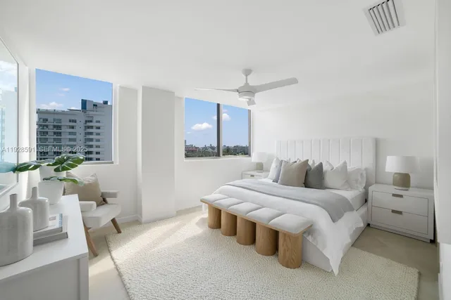 a bathroom with a sink mirror and toilet