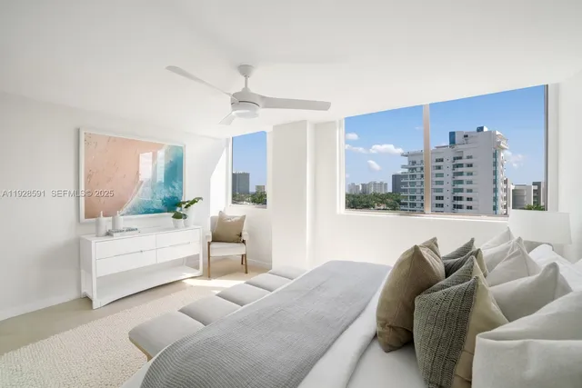 a bedroom with a bed and a mirror