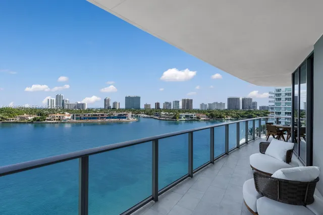 a living room with furniture potted plant and window