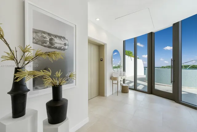 a view of a patio with couches chairs and potted plants