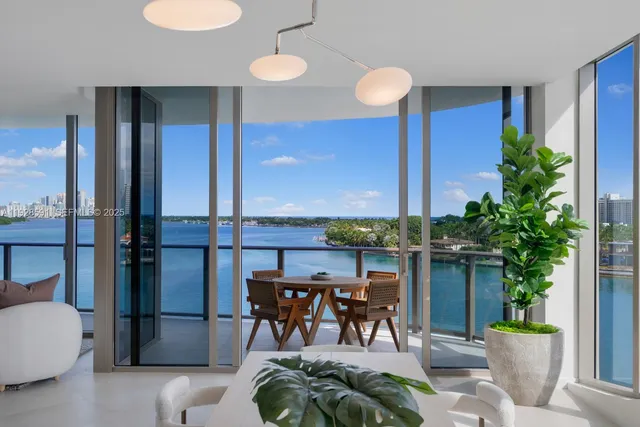 a view of a livingroom with furniture and a potted plant