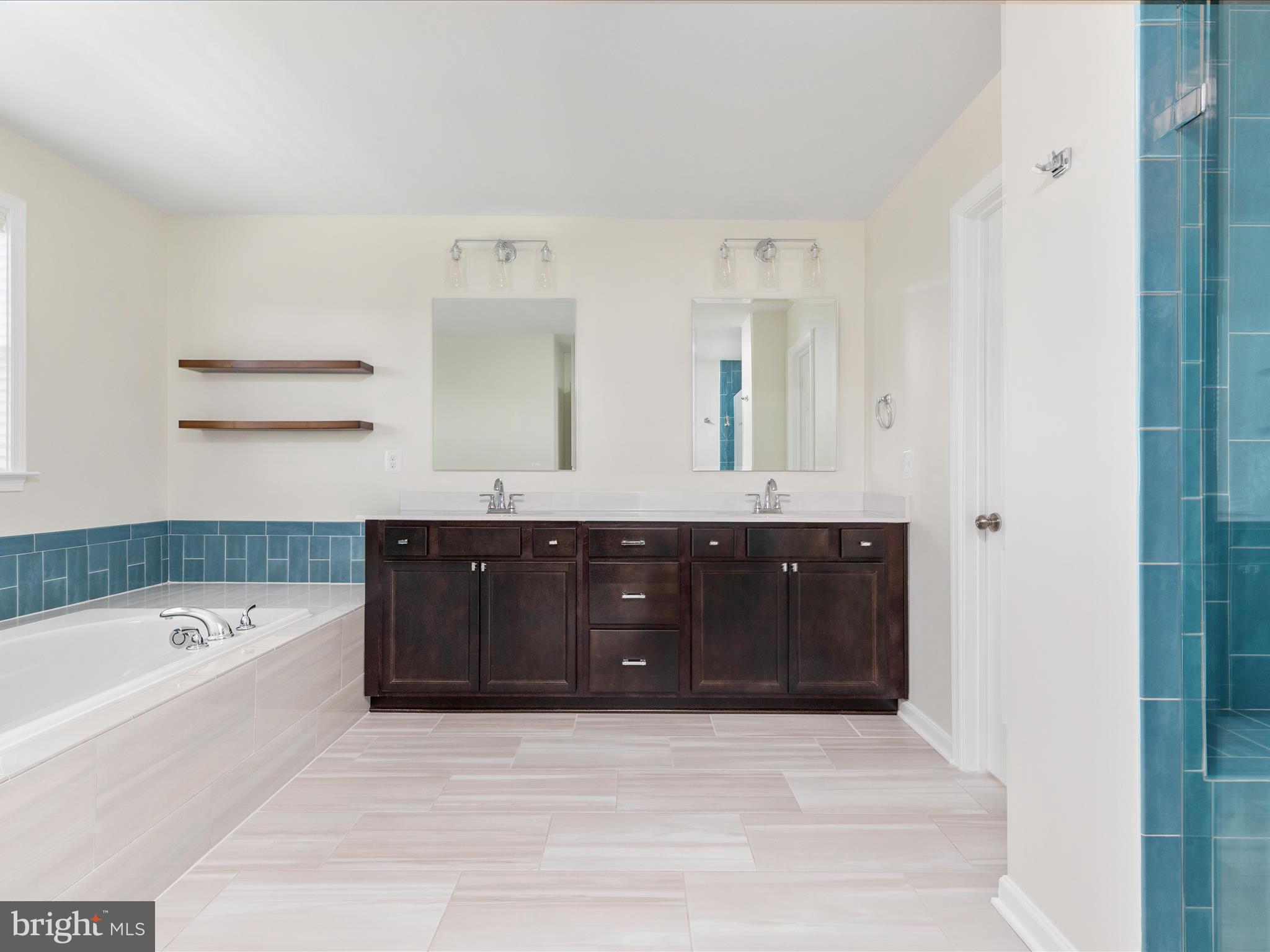 138 Jewel Stephenson, VA 22656 - Photo 25 of 70 a bathroom with a tub sink and mirror