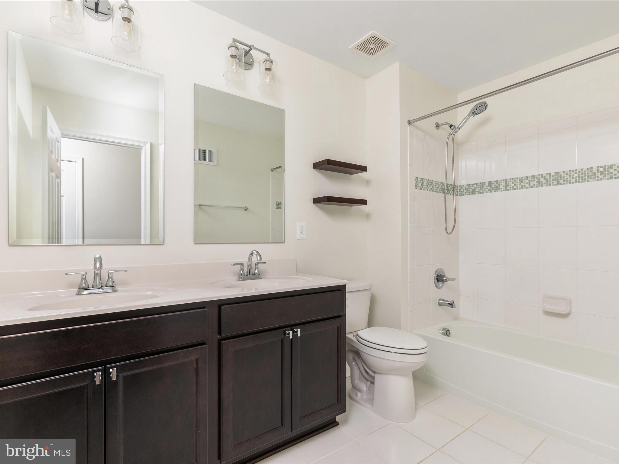 138 Jewel Stephenson, VA 22656 - Photo 36 of 70 a bathroom with a double vanity sink toilet mirror and shower