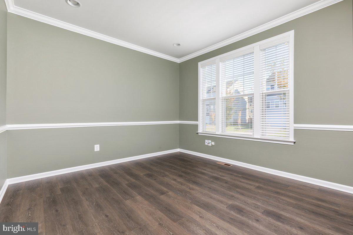 138 Jewel Stephenson, VA 22656 - Photo 5 of 70 a view of an empty room with wooden floor and a window