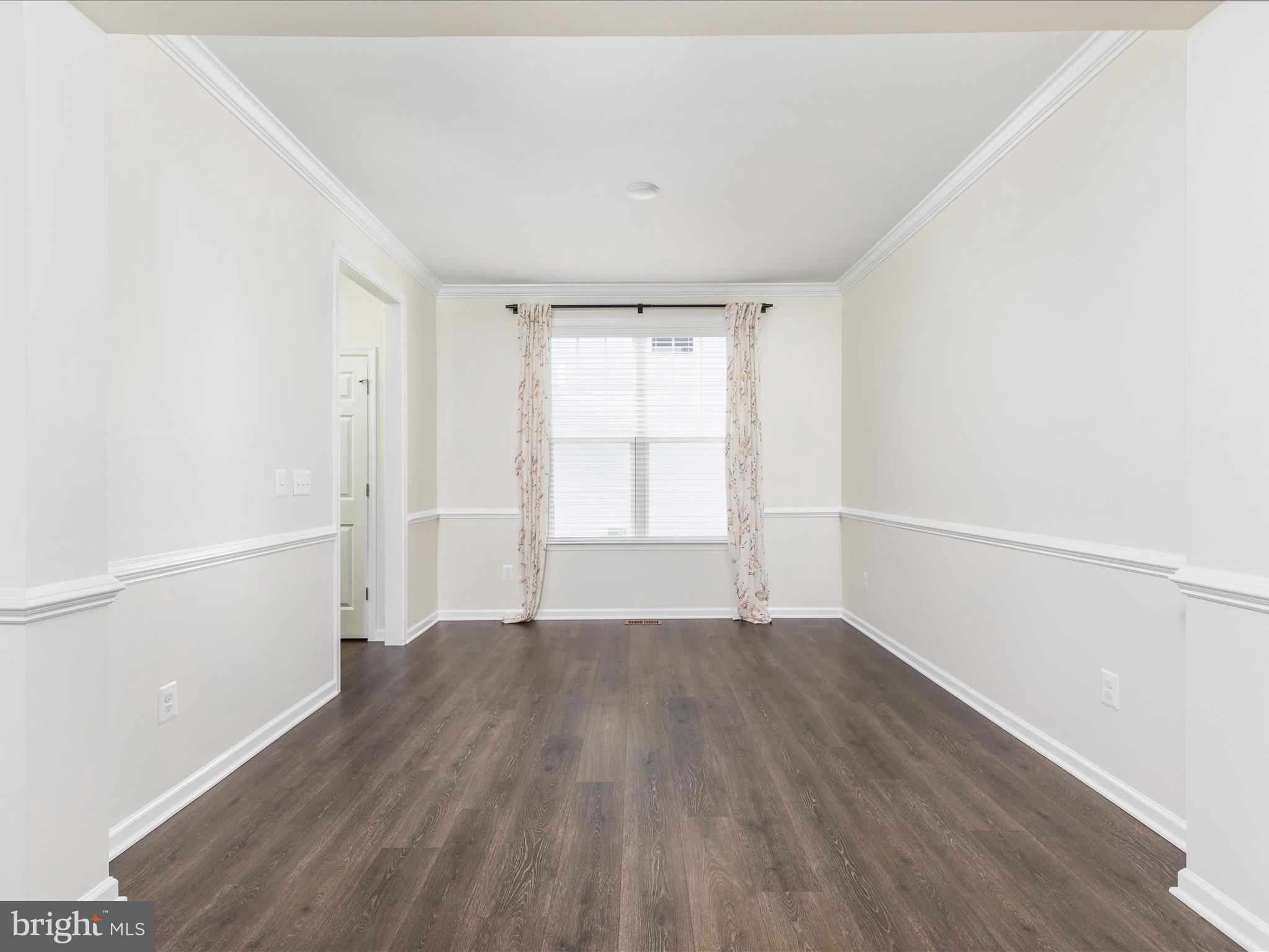 138 Jewel Stephenson, VA 22656 - Photo 7 of 70 a view of an empty room with wooden floor and a window