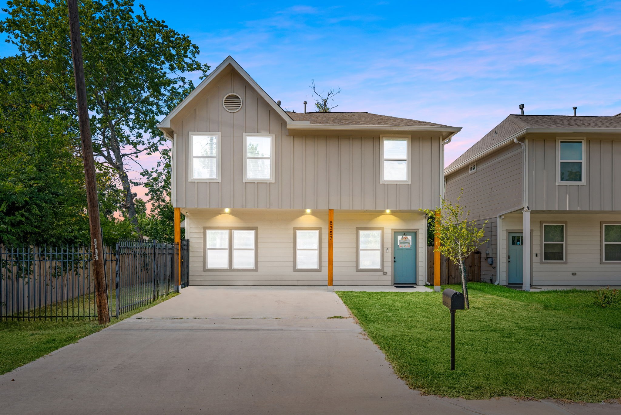 8357 Tate Street Houston, TX 77028 - Photo 1 of 42 a front view of a house with a yard and garage