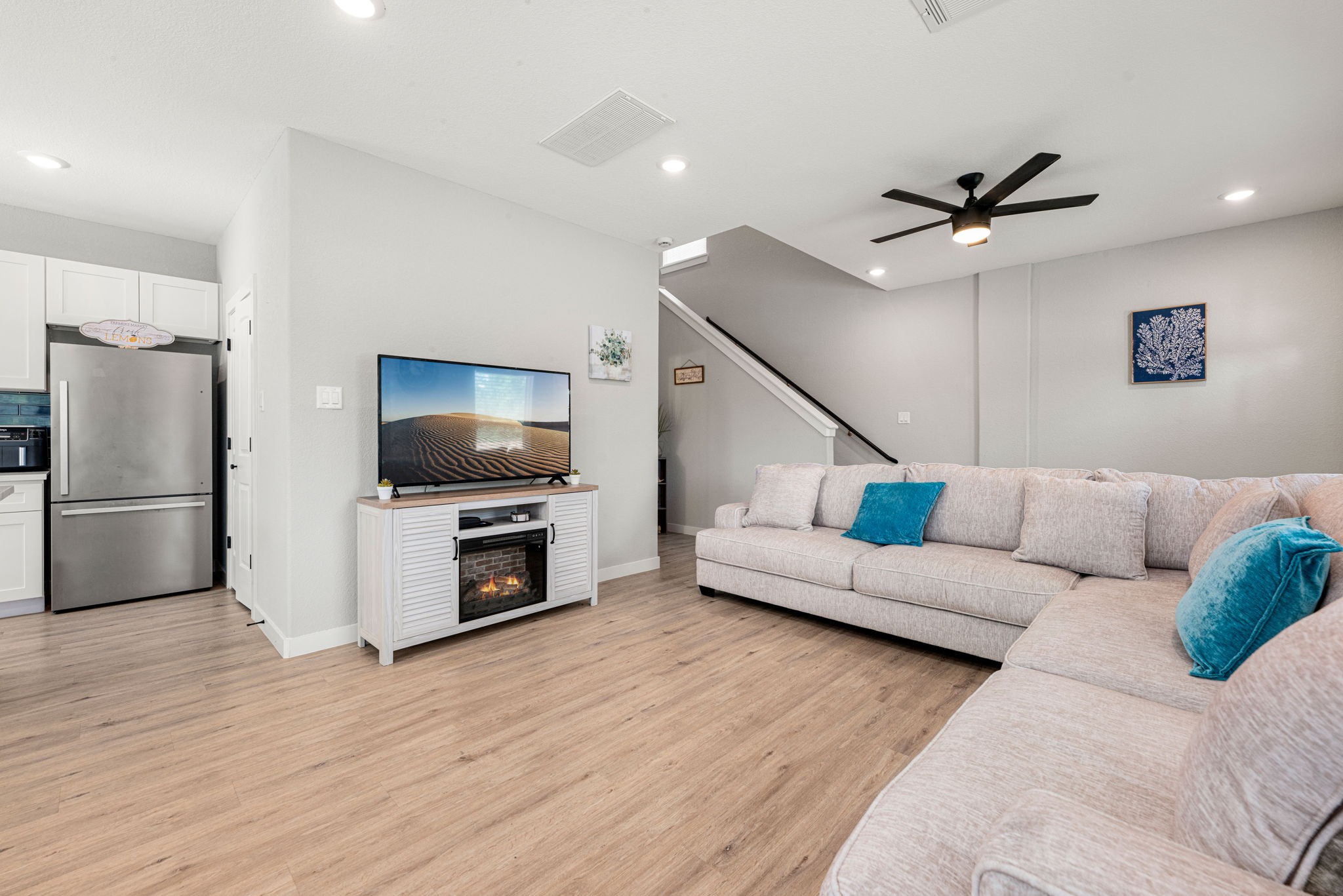 8357 Tate Street Houston, TX 77028 - Photo 11 of 42 a living room with furniture and a flat screen tv