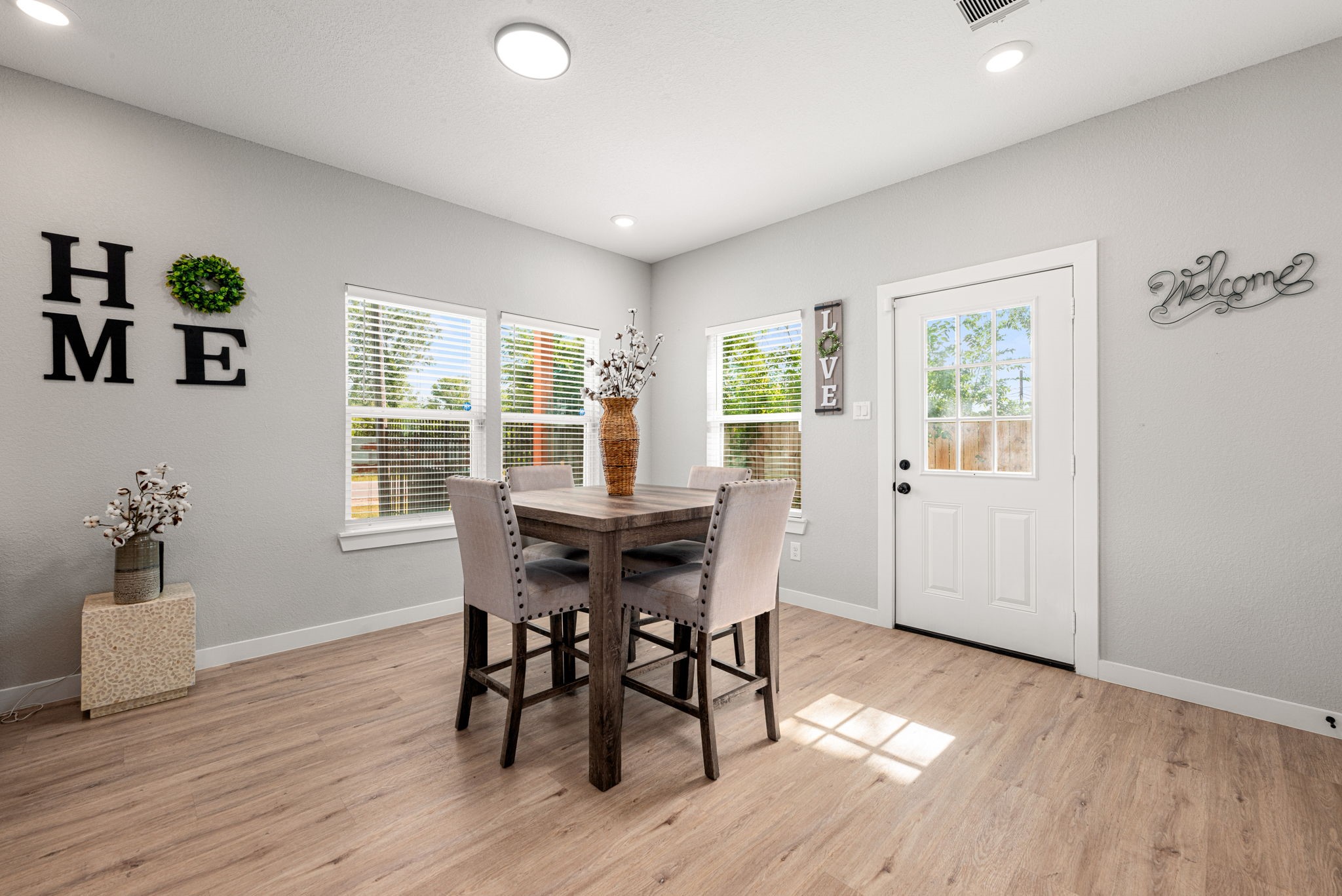 8357 Tate Street Houston, TX 77028 - Photo 12 of 42 a view of a dining room with furniture and wooden floor