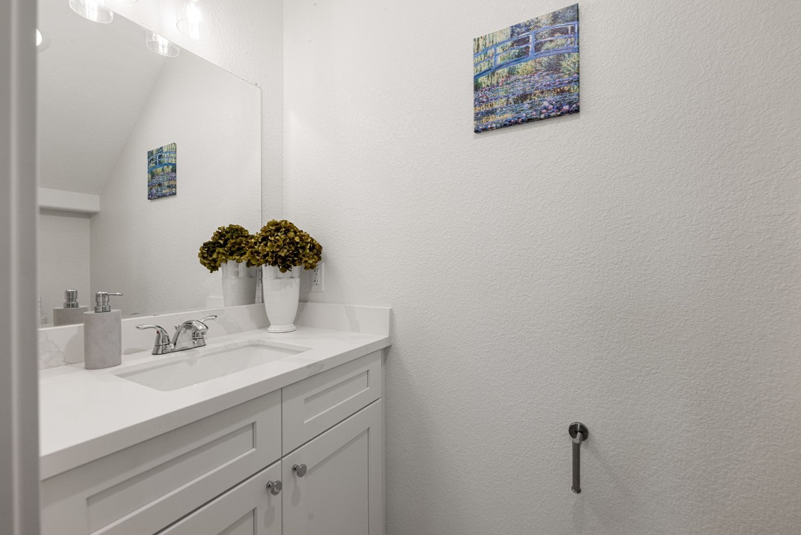 8357 Tate Street Houston, TX 77028 - Photo 18 of 40 a bathroom with a sink and a mirror