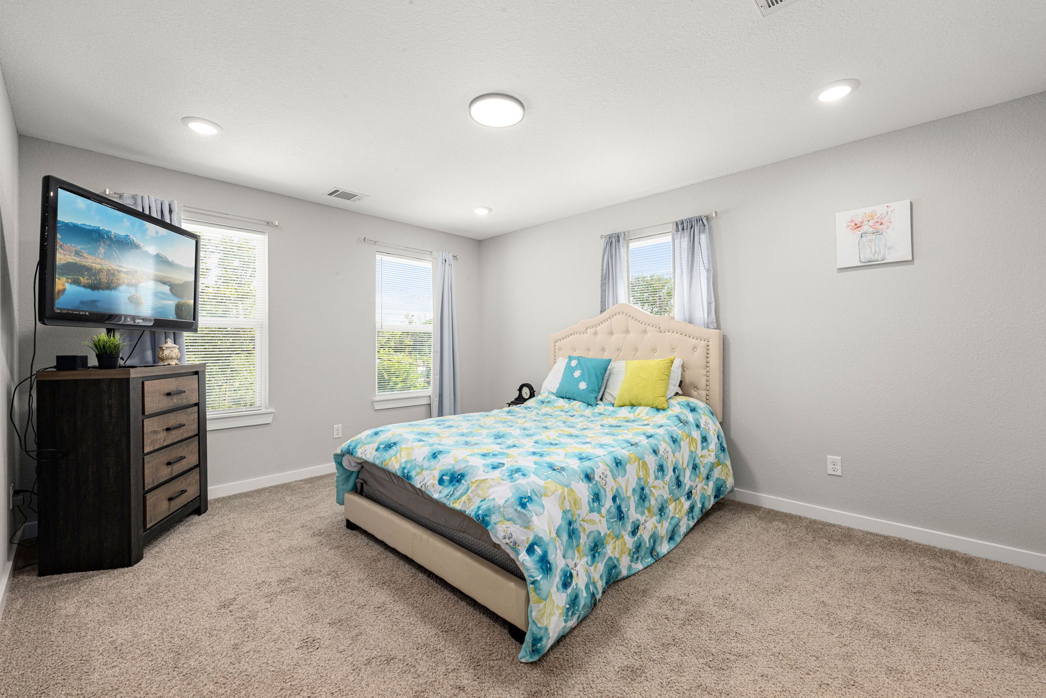 8357 Tate Street Houston, TX 77028 - Photo 24 of 42 a bedroom with a bed and dresser