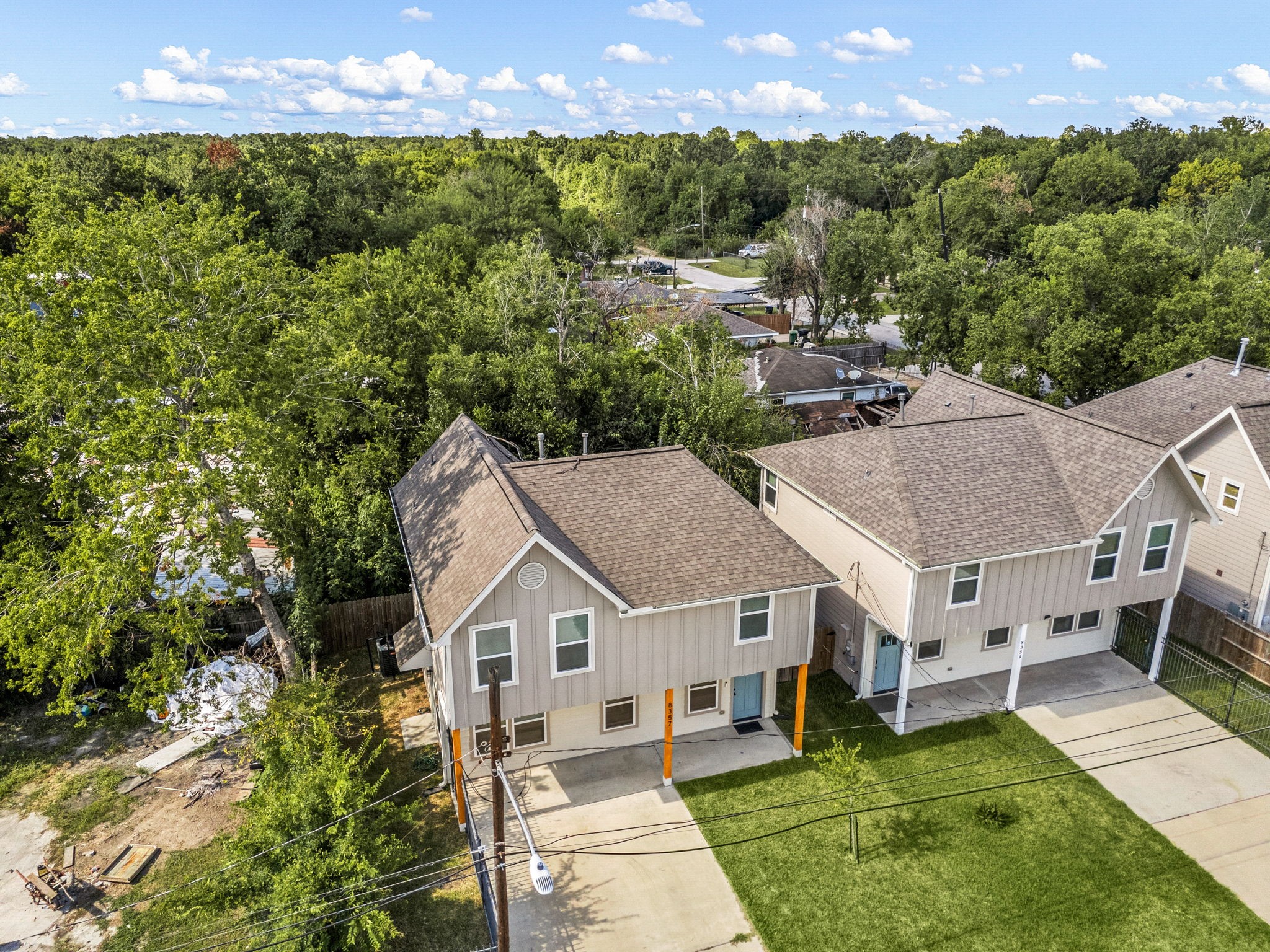 8357 Tate Street Houston, TX 77028 - Photo 33 of 40 a aerial view of a house with a yard and a large tree