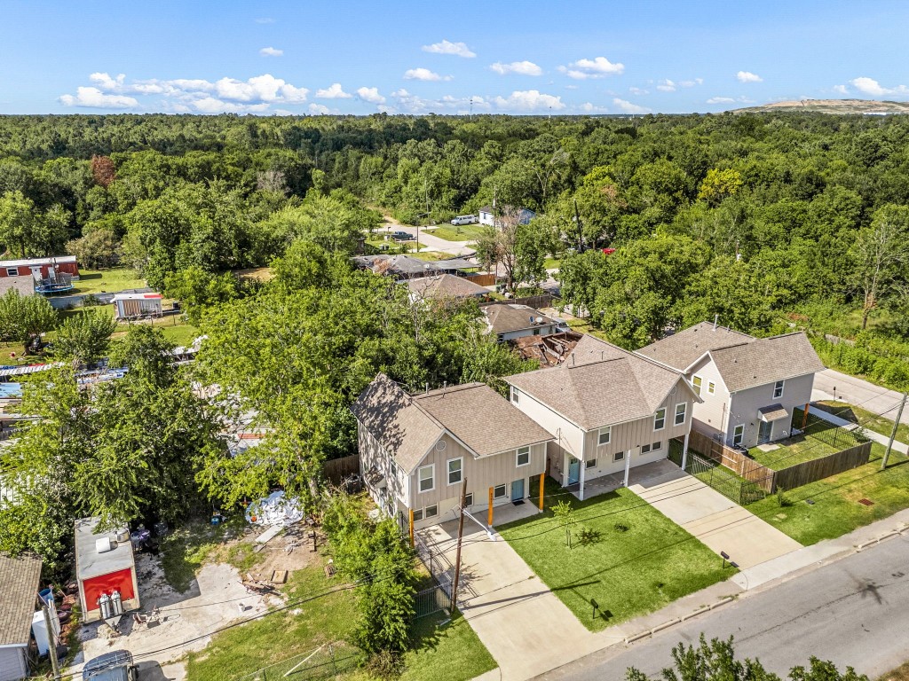 8357 Tate Street Houston, TX 77028 - Photo 34 of 40 an aerial view of residential houses with outdoor space and trees